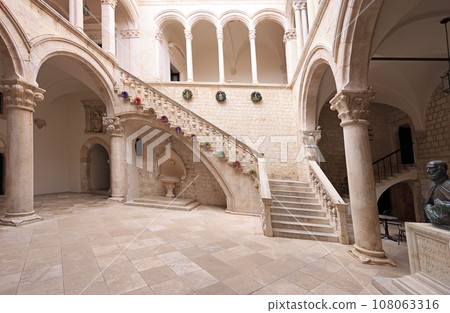 Atrium and staircase inside Rector's Palace in old town of Dubrovnik. The palace was used to serve as the seat of the Rector of the Republic of Ragusa between the 14th century and 1808. Atrium and staircase inside Rector's Palace in old town of Dubrovnik. The palace was used to serve as the seat of the Rector of the Republic of Ragusa between the 14th century and 1808. 108063316