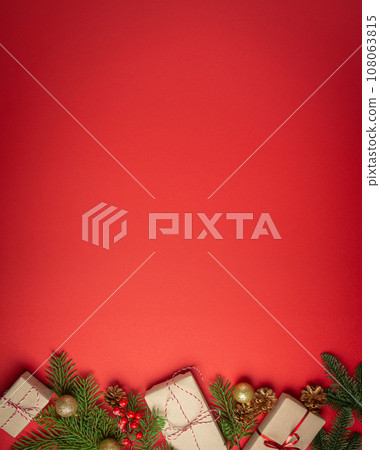 Christmas or New Year celebration red paper festive background with decoration fir tree, wrapped present boxes, cones, berries, sparkly red balls. Space for text. Christmas or New Year celebration red paper festive background with decoration fir tree, wrapped present boxes, cones, berries, sparkly red balls. Space for text. 108063815