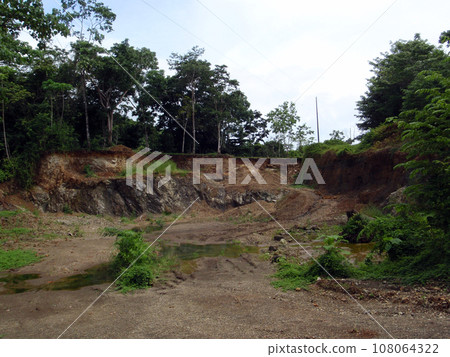 Small Abandoned rock quarry Small Abandoned rock quarry 108064322
