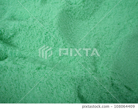 large amount of Green bath salt with scoop holes in it 108064409