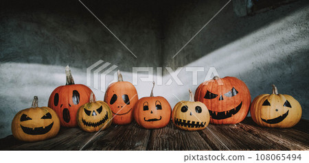 scary funny Halloween pumpkins on wooden table 108065494