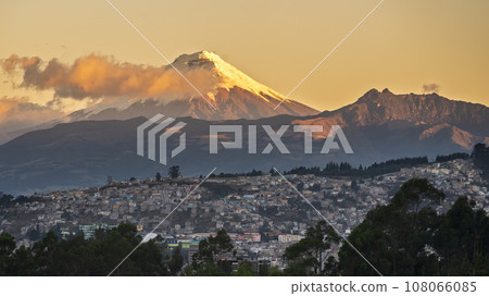 South-east of the city of Quito and the Cotopaxi volcano (5897m) illuminated by a golden sunset light 108066085