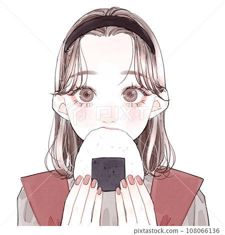 A woman eating a rice ball A woman eating a rice ball 108066136
