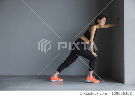 A woman wearing sportswear 108066368