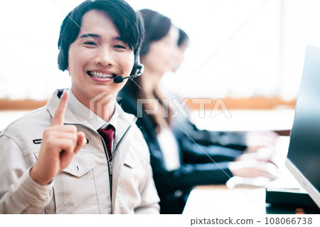 Young engineer working at a call center Young engineer working at a call center 108066738