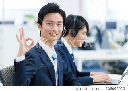A man working in a call center A man working in a call center 108066910