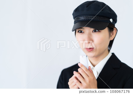 Young female driver checking alcohol before driving, white background Young female driver checking alcohol before driving, white background 108067176