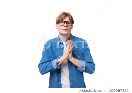 young smart european man with copper hair wears denim shirt is brainstorming 108067851