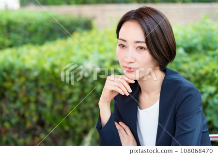 Business woman relaxing on the terrace Business woman relaxing on the terrace 108068470