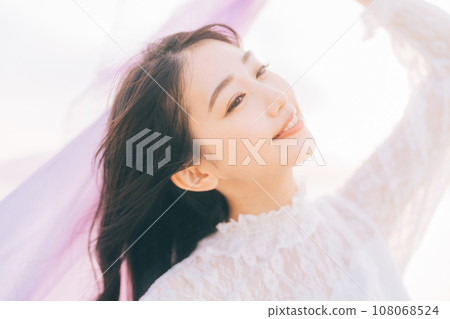 Woman portrait on sunset background Woman portrait on sunset background 108068524