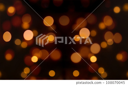 Defocused Glowing Lights Abstract Background, Warm Lights Over Dark Background. 108070045