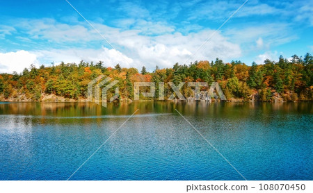 Pink Lake, Gatineau, Quebec, Canada during fall season with colorful tree 108070450