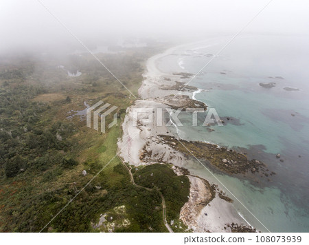 Exploring the beach in the mist morning at Kejimkujik National Park Seaside, Nova Scotia, Canada 108073939