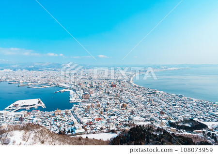 Beautiful landscape and cityscape from Hakodate Mountain with Snow in winter season. landmark and popular for attractions in Hokkaido, Japan.Travel and Vacation concept 108073959