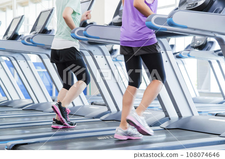 Young woman running in sports gym 108074646
