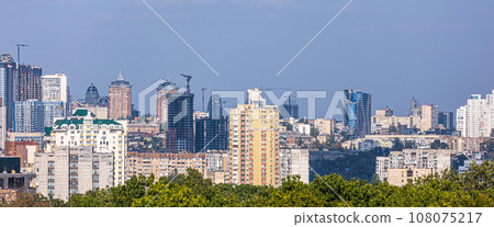 Aerial photography of residential areas of Kyiv with a view of the railway station and new skyscrapers under construction, aerial view, city photography. Copy space 108075217