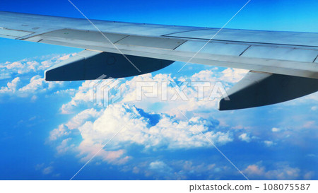 Landscape of aircraft wing, blue sky and sea of clouds Landscape of aircraft wing, blue sky and sea of clouds 108075587