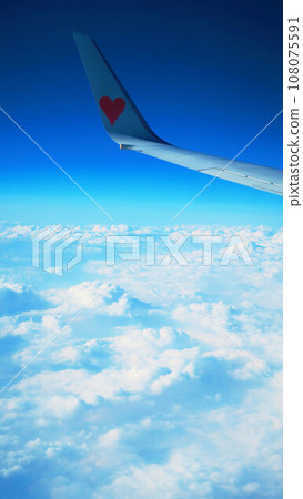 Landscape of aircraft wing, blue sky and sea of clouds Landscape of aircraft wing, blue sky and sea of clouds 108075591