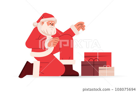 santa claus in red costume sitting on floor near gift boxes happy new year merry christmas holidays celebration concept santa claus in red costume sitting on floor near gift boxes happy new year merry christmas holidays celebration concept 108075694