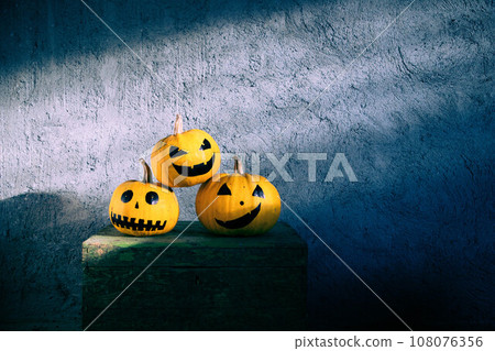 scary funny Halloween pumpkins on wooden table 108076356
