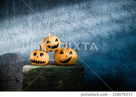 scary funny Halloween pumpkins on wooden table 108076357