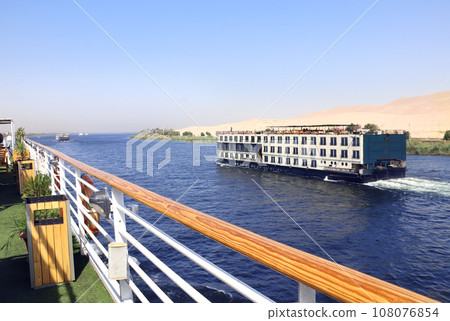 Cruise ship on the Nile river, Egypt, Africa. Luxury Nile Cruise. Summer vacation, relaxing on cruise ships Cruise ship on the Nile river, Egypt, Africa. Luxury Nile Cruise. Summer vacation, relaxing on cruise ships 108076854