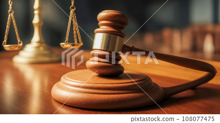 legal services, judge's gavel. wooden legal gavel on an office desk, judge's gavel for final verdict, wooden gavel for judgment, with judge in background 108077475
