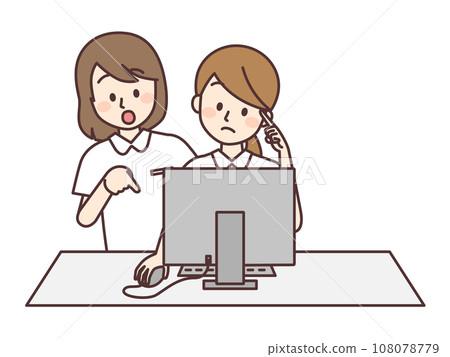A nurse instructing a junior colleague how to use a computer 108078779