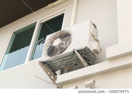 Air condition outdoor unit compressor install outside the house 108079473
