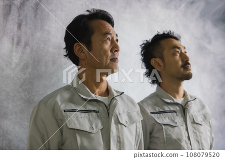 Two men in work clothes 108079520