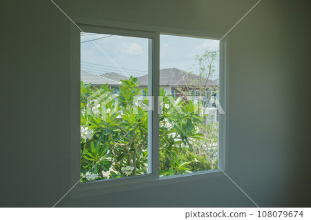 Empty room with glass window frame house interior on concrete wall Empty room with glass window frame house interior on concrete wall 108079674