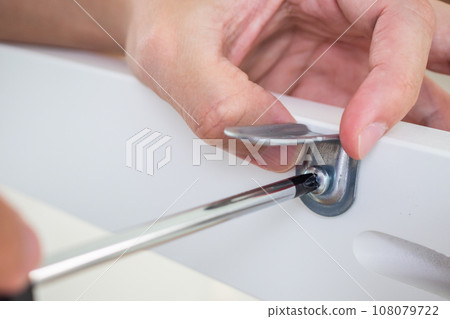 Assembly furniture using screwdriver at home Assembly furniture using screwdriver at home 108079722