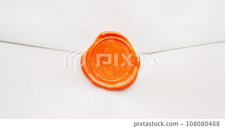 Wax seal stamp on white letter paper background 108080488