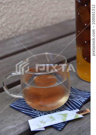 Enjoying plum juice on the veranda Enjoying plum juice on the veranda 108081312