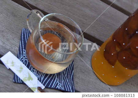 Enjoying plum juice on the veranda 108081313