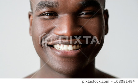Teeth care. Oral health. Mouth hygiene. Dental medicine. Confident happy man face with perfect flawless white smile isolated on light background. 108081494