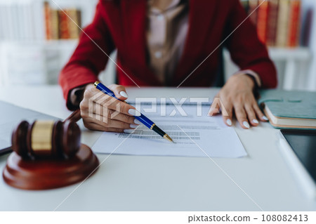 The lawyer with a client discussing contract paper, a Business lawyer working about legal legislation in the courtroom to help their customer, contract and agreement concept 108082413
