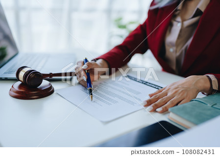 The lawyer with a client discussing contract paper, a Business lawyer working about legal legislation in the courtroom to help their customer, contract and agreement concept 108082431