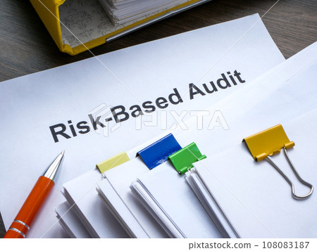 Risk based audit report and a pen. Risk based audit report and a pen. 108083187
