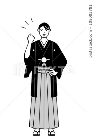 A man wearing a crested hakama doing a fist pump 108083781