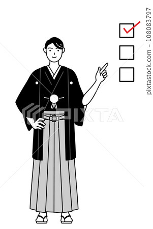 一名穿著鳳頭袴的男子指著清單 一名穿著鳳頭袴的男子指著清單 108083797