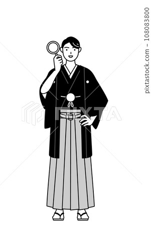 一個穿著鳳頭袴的男人透過放大鏡看 一個穿著鳳頭袴的男人透過放大鏡看 108083800