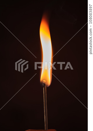 a lighted match on a dark background a lighted match on a dark background 108083897