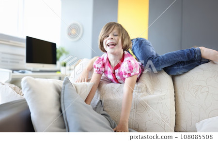 Girl and boy play around on couch at home and laugh. Girl and boy play around on couch at home and laugh. 108085508