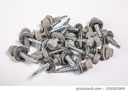 Group of roofing screws on a white background 108085969