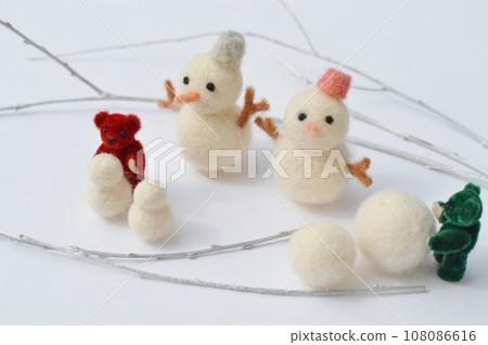 Felt snowman, teddy bear and silver branches 108086616