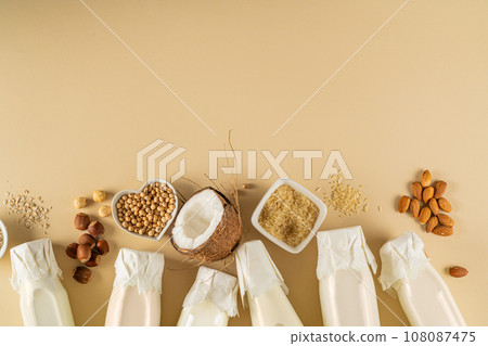 Plant based milk concept - selection of alternative milks on pastel background 108087475