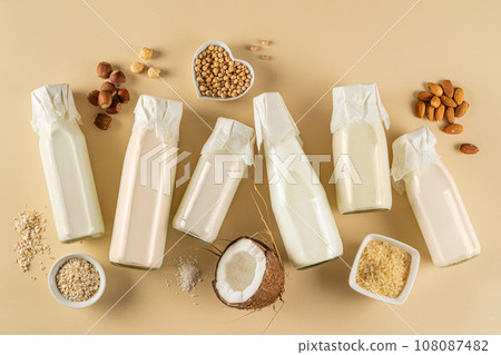 Plant based milk concept - selection of alternative milks on pastel background Plant based milk concept - selection of alternative milks on pastel background 108087482