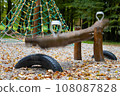 Wooden swing made of logs on the playground 108087828