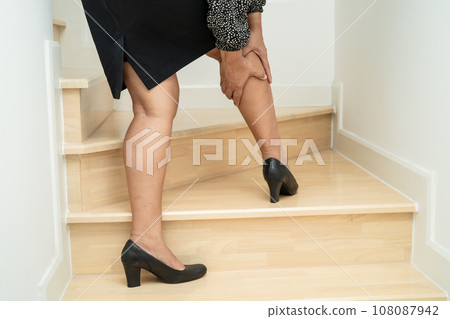 Asian woman patient fall down the stairs because slippery surfaces. Asian woman patient fall down the stairs because slippery surfaces. 108087942